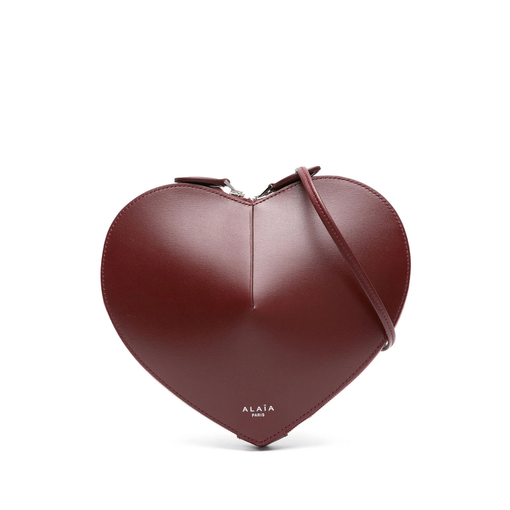 Alaïa Le Cœur crossbody bag in lacquer red — alternate angle | La Parisienne Qatar