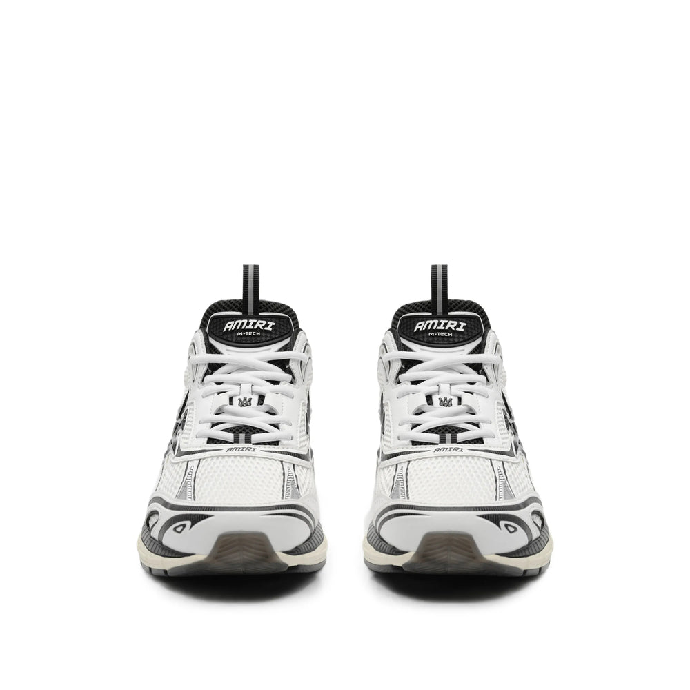 Amiri sneakers in white calf leather — side profile | La Parisienne Qatar