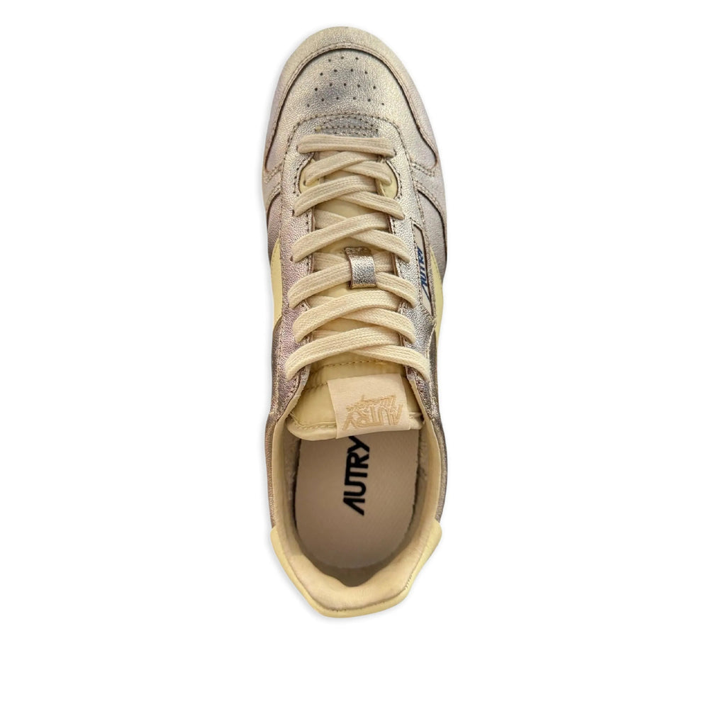 Autry metallic sneakers in gold — side profile | La Parisienne Qatar