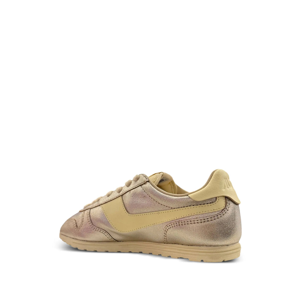 Autry metallic sneakers in gold — detail view | La Parisienne Qatar