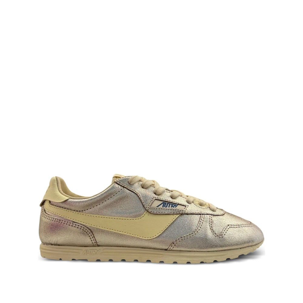 Autry metallic sneakers in gold — front view | La Parisienne Qatar