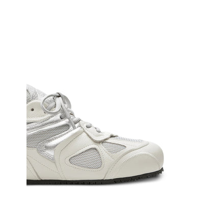 Axel Arigato Slow sneakers in neutral tones — side profile | La Parisienne Qatar