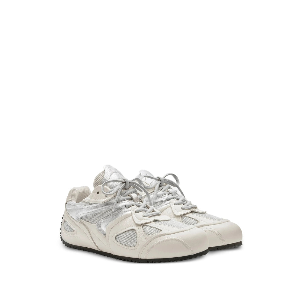 Axel Arigato Slow sneakers in neutral tones — rear view | La Parisienne Qatar
