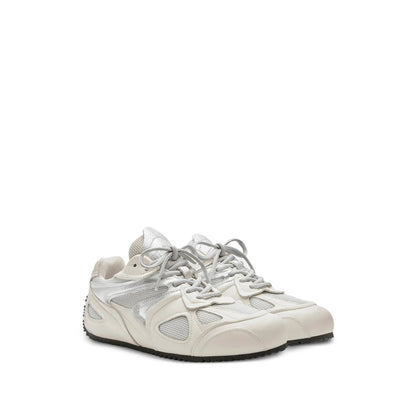 Axel Arigato Slow sneakers in neutral tones — rear view | La Parisienne Qatar