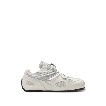 Axel Arigato Slow sneakers in neutral tones — front view | La Parisienne Qatar