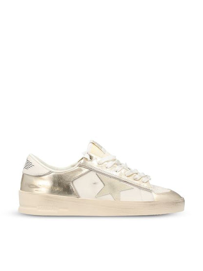 Golden Goose Stardan sneakers in white and gold leather — front view | La Parisienne Qatar