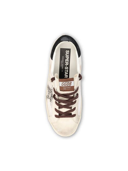 Golden Goose Super-Star sneakers in white and black leather — side profile | La Parisienne Qatar