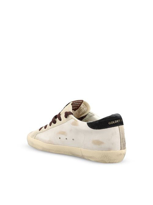 Golden Goose Super-Star sneakers in white and black leather — rear view | La Parisienne Qatar