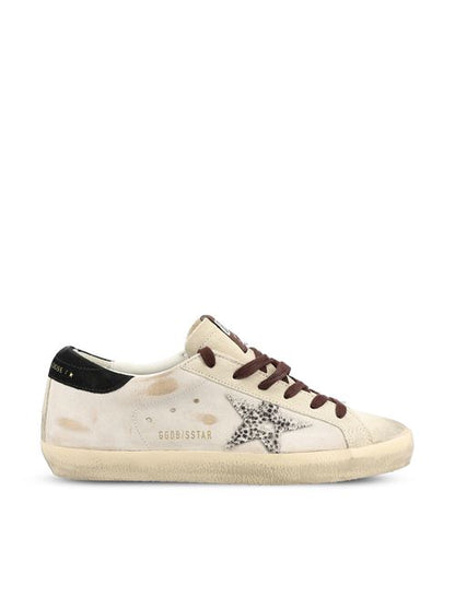 Golden Goose Super-Star sneakers in white and black leather — front view | La Parisienne Qatar