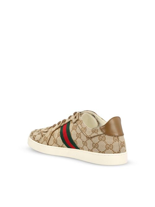 Gucci Stretch low-top sneakers in sand and dark brown GG canvas — detail view | La Parisienne Qatar