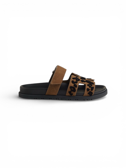 Hermès Chypre smoked brown and black calfskin sandal — side profile | La Parisienne Qatar