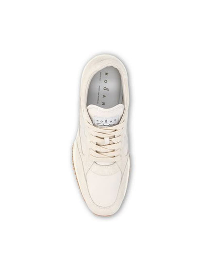 Hogan Interactive sneakers in beige suede — side profile | La Parisienne Qatar