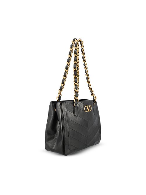 Loewe Hammock Flip bag in brown calfskin — detail view | La Parisienne Qatar