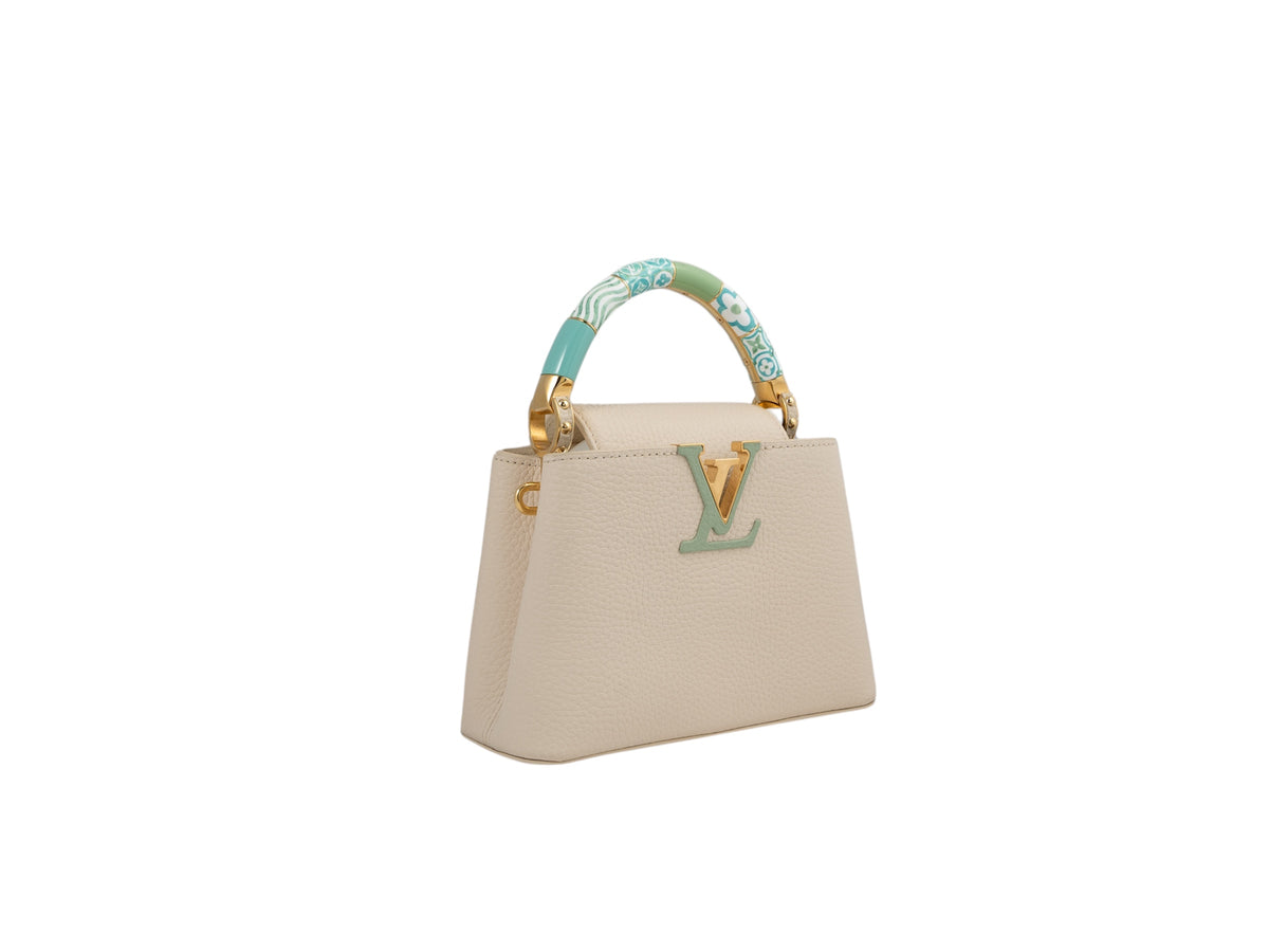 Louis Vuitton Capucines BB bag in cream Taurillon leather — detail view | La Parisienne Qatar