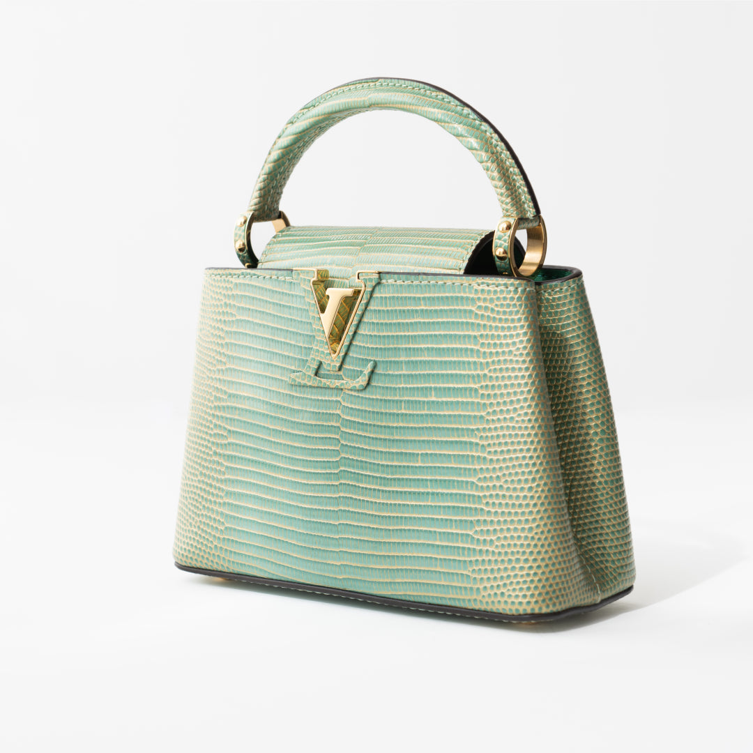 Louis Vuitton Capucines Mini bag in turquoise lizard — side profile | La Parisienne Qatar