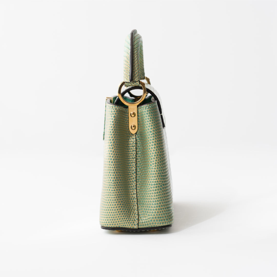 Louis Vuitton Capucines Mini bag in turquoise lizard — detail view | La Parisienne Qatar
