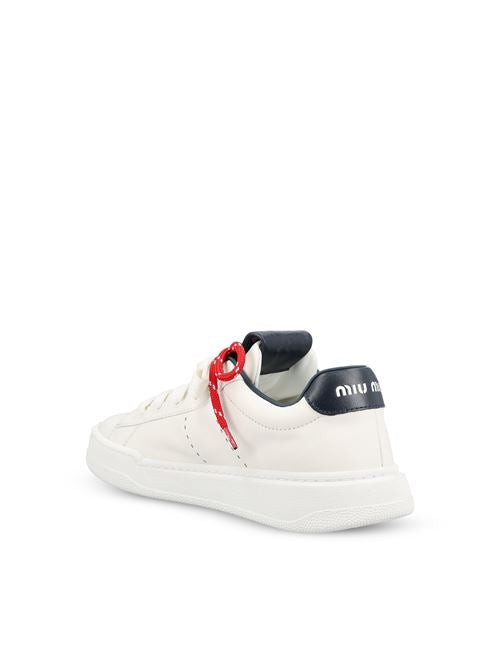 Miu Miu leather sneakers in white and blue — detail view | La Parisienne Qatar