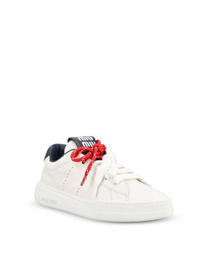 Miu Miu leather sneakers in white and blue — rear view | La Parisienne Qatar