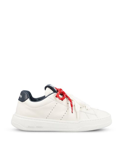 Miu Miu leather sneakers in white and blue — front view | La Parisienne Qatar