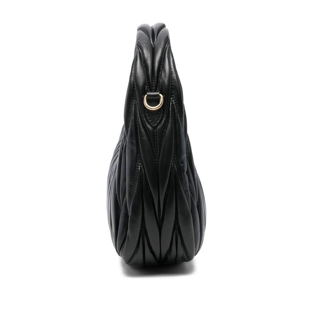 Miu Miu matelassé shoulder bag in black lambskin — side profile | La Parisienne Qatar