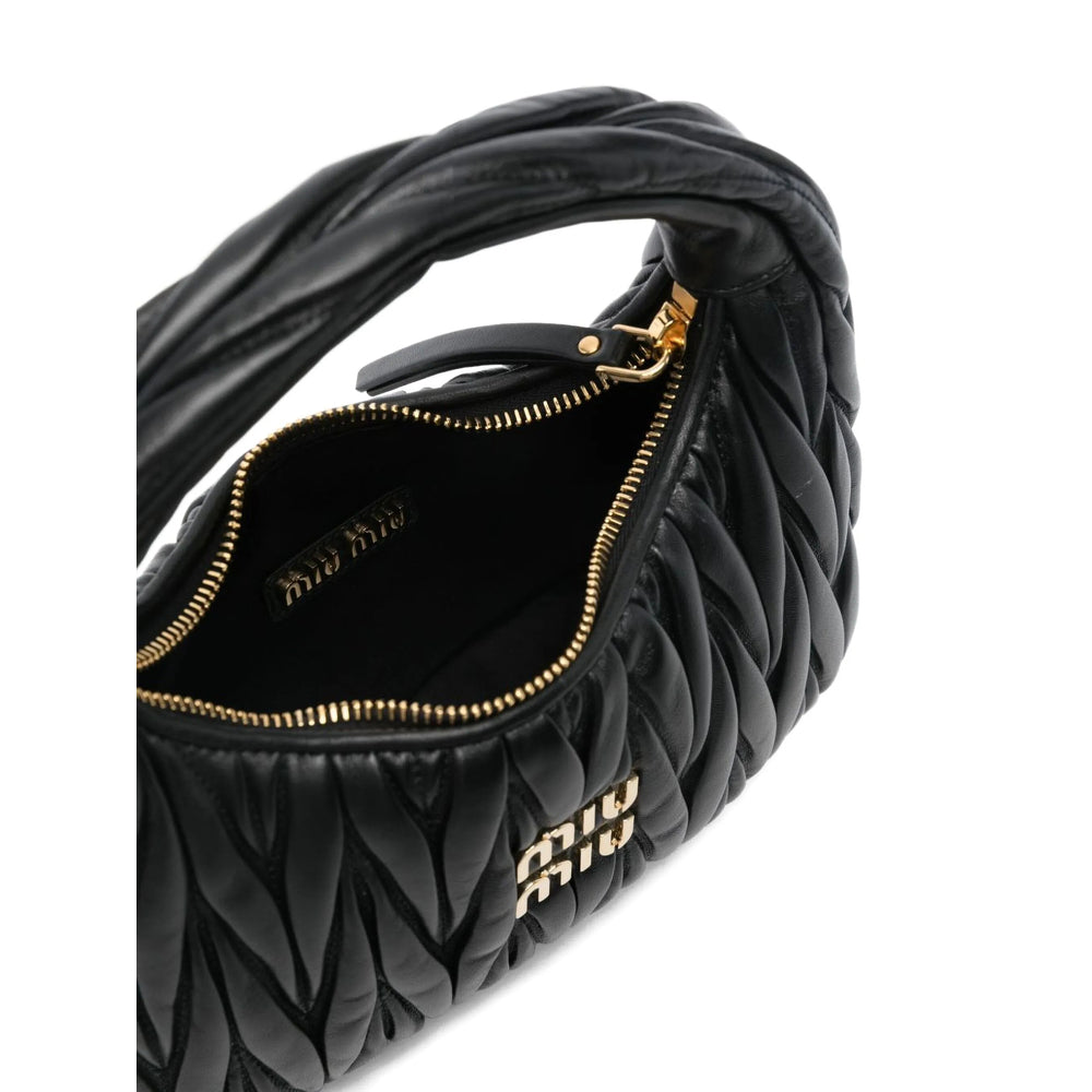 Miu Miu matelassé shoulder bag in black lambskin — detail view | La Parisienne Qatar