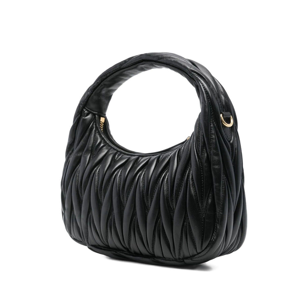 Miu Miu matelassé shoulder bag in black lambskin — rear view | La Parisienne Qatar