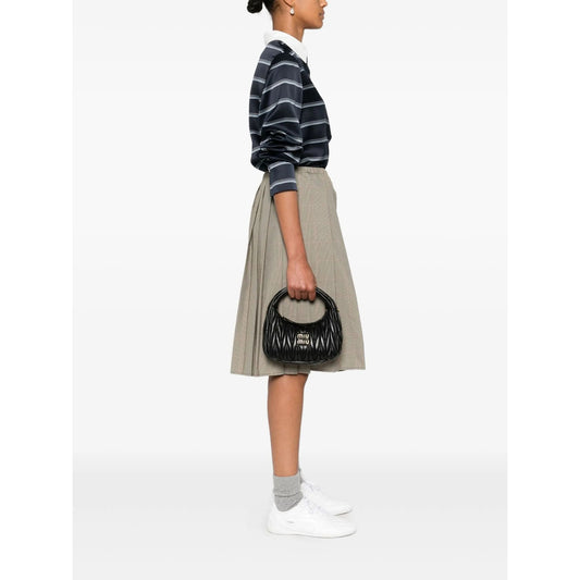 Miu Miu matelassé shoulder bag in black lambskin — front view | La Parisienne Qatar