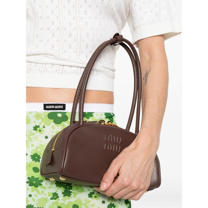 Miu Miu shoulder bag in brown calf leather — detail view | La Parisienne Qatar