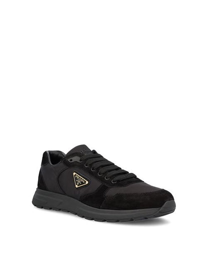 Prada Prax 20 sneakers in black Re-Nylon and suede — rear view | La Parisienne Qatar