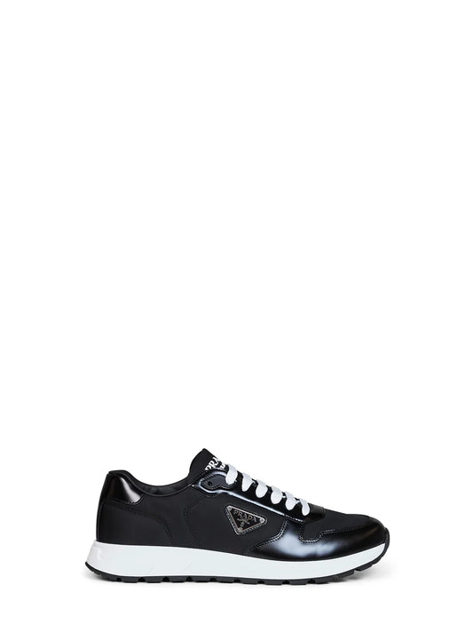 Prada Re-Nylon platform sneakers in black with white sole — front view | La Parisienne Qatar