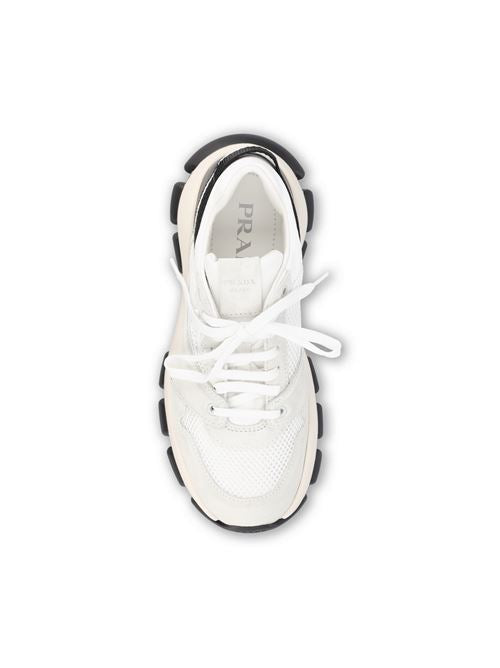 Prada technical mesh and suede sneakers in black and white — side profile | La Parisienne Qatar