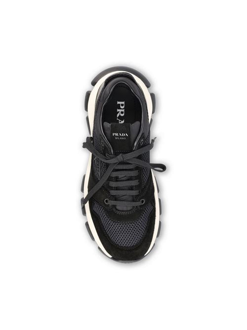 Prada technical mesh and suede sneakers in black — side profile | La Parisienne Qatar