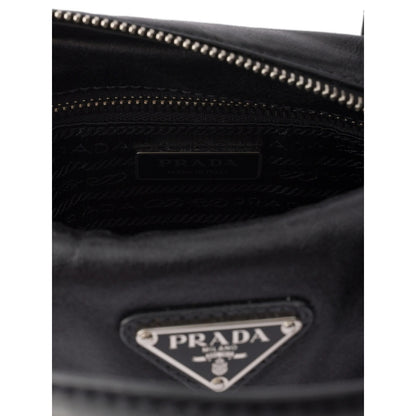 Prada top-handle handbag in black calf leather — styling view | La Parisienne Qatar