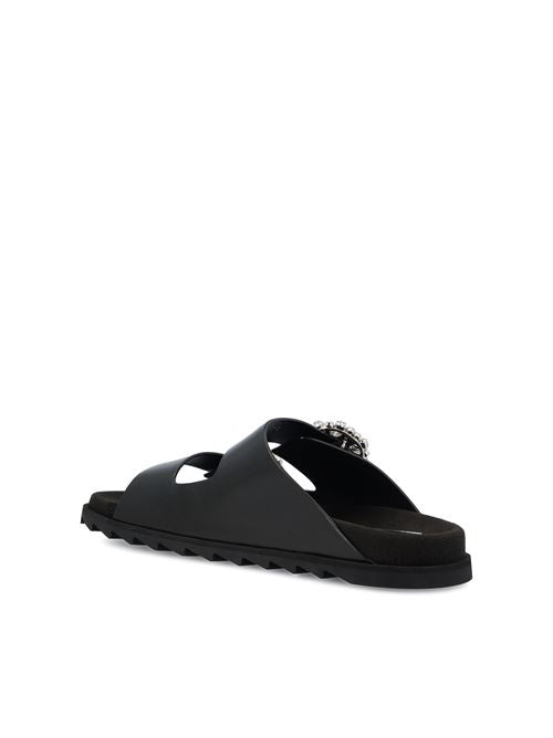 Roger Vivier leather flats in black calfskin — detail view | La Parisienne Qatar