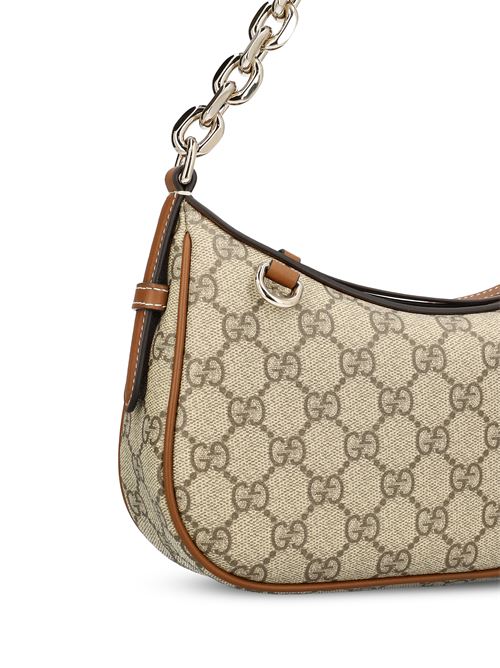 حقيبة كتف GG Emblem صغيرة من Gucci، قماش GG بيج وبني