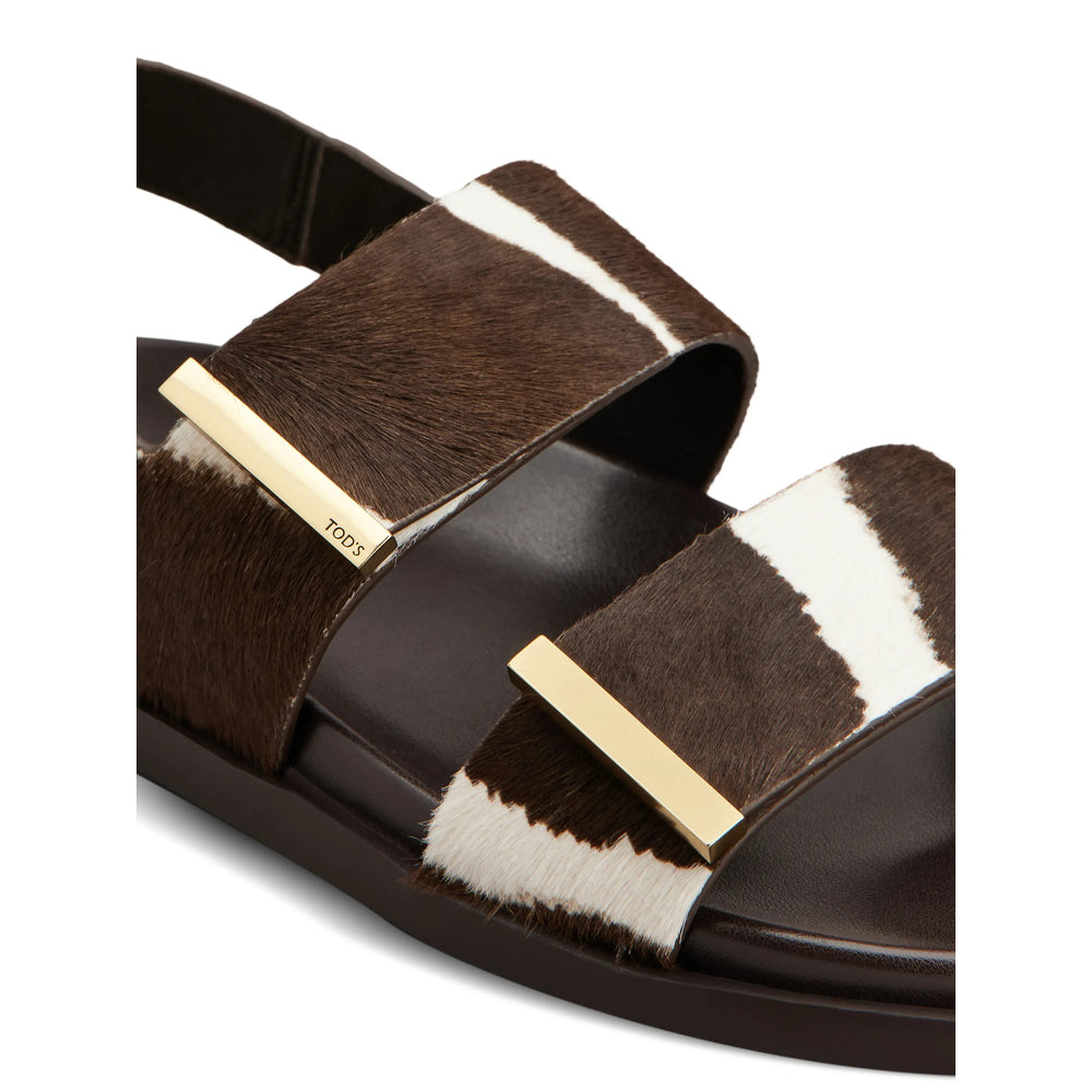 Tod's leather loafers in brown calfskin — side profile | La Parisienne Qatar