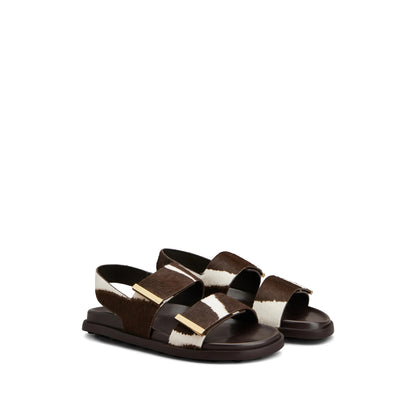 Tod's leather loafers in brown calfskin — rear view | La Parisienne Qatar