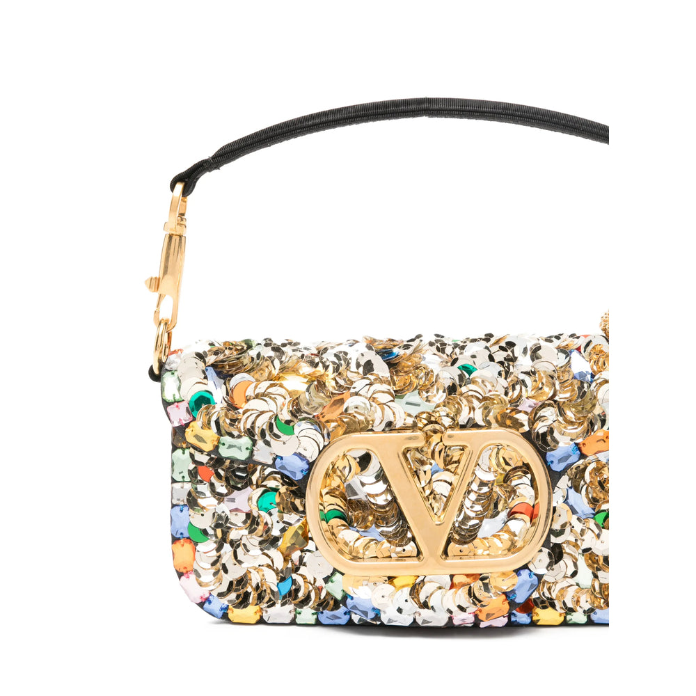 Valentino Garavani evening bag in gold sequin — side profile | La Parisienne Qatar
