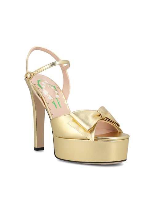 Valentino Garavani platform sandals in gold — rear view | La Parisienne Qatar