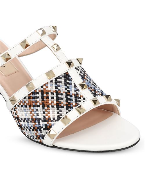 Valentino Garavani Rockstud sandals in white — side profile | La Parisienne Qatar