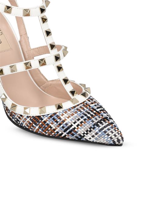 Valentino Garavani Rockstud slingback pumps in white — side profile | La Parisienne Qatar