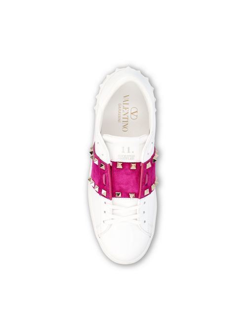 Valentino Garavani Rockstud Untitled sneakers in white and pink — side profile | La Parisienne Qatar