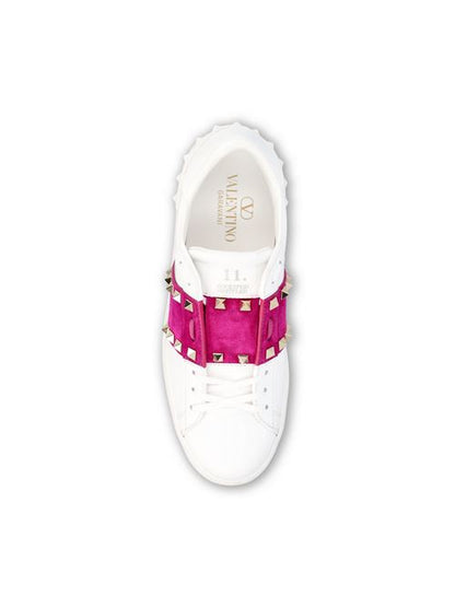 Valentino Garavani Rockstud Untitled sneakers in white and pink — side profile | La Parisienne Qatar