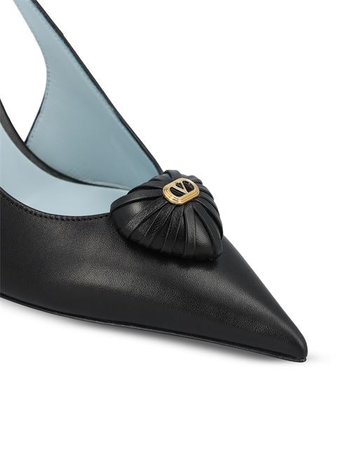 Valentino Garavani Royal Coeur slingback pumps in black — side profile | La Parisienne Qatar