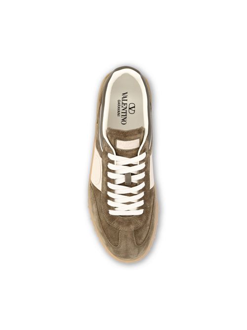 Valentino Garavani Upvillage low-top sneakers in green — side profile | La Parisienne Qatar