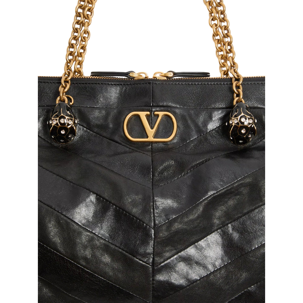 Valentino Garavani VLogo Signature shoulder bag in black — detail view | La Parisienne Qatar
